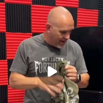 Chaz unboxing a Not Lucky, Fortunate tee